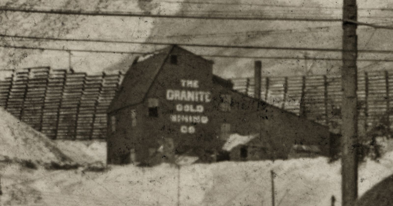 The Dillon Mine Shaft House is marked as part of the Granite Gold Mining Company in this cropped view of a postcard, enhanced and sadly not very sharp but it was after all only seen as a small part of the upper left quadrant of said postcard, taken on December 6, 1913 after the snow storm covering the District with lot of snow. While not a sharp view it still is one of the best views I have of this shaft house, and is a good companion to a stereoview from nearly the opposite direction.