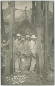 Men on Cage Cripple Creek District